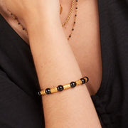 Armband mit Ethno-Zylinderperlen und schwarzen Onyx-Steinkugeln Armband KOOMPLIMENTS