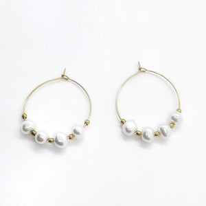 Fine hoop earrings with white pearls