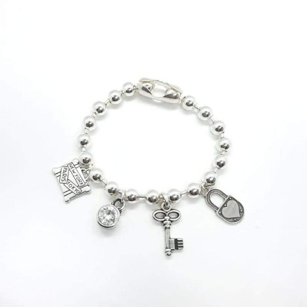 Silber Armband mit diversen Anhänger - Love traveling Armband KOOMPLIMENTS