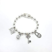 Silber Armband mit diversen Anhänger - Love traveling Armband KOOMPLIMENTS