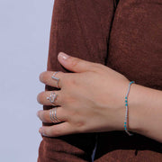 Silbernes Armband mit türkisfarbenen Perlen Armband KOOMPLIMENTS