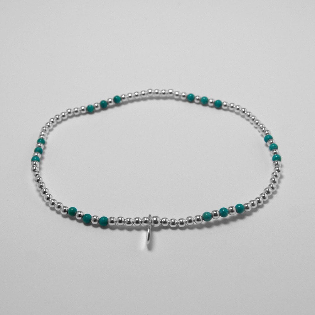Silbernes Armband mit türkisfarbenen Perlen Armband KOOMPLIMENTS