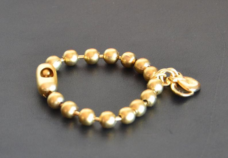 Spanisches Armband Gold mit Kastagnetten Armband KOOMPLIMENTS