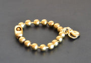 Spanisches Armband Gold mit Kastagnetten Armband KOOMPLIMENTS